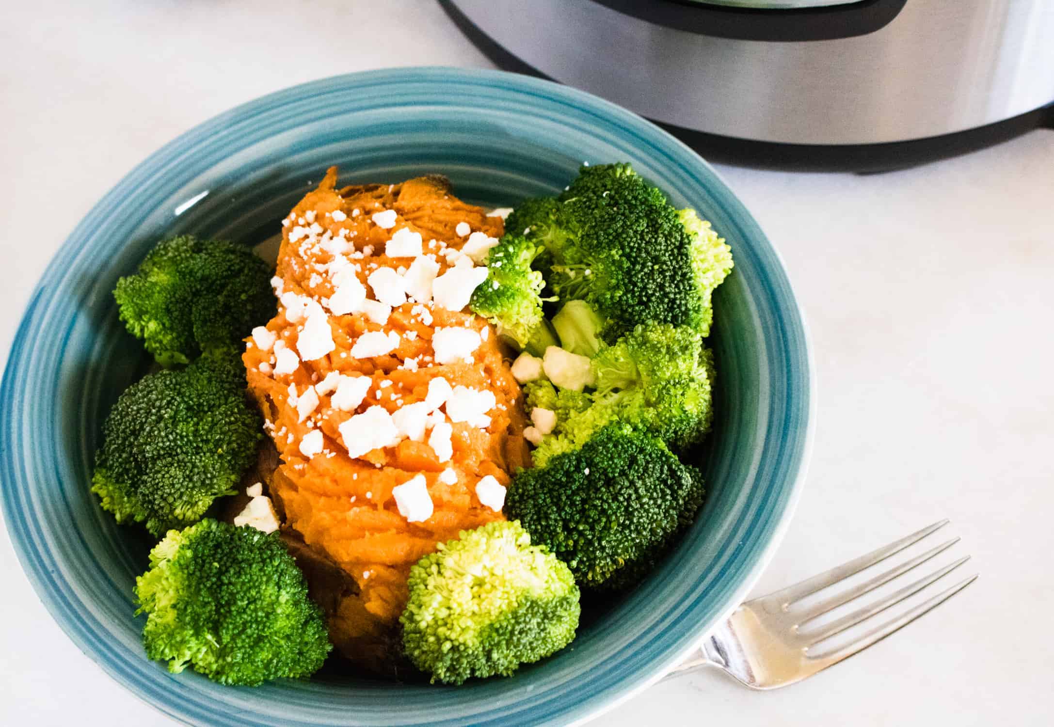 sweet potatoes with broccoli on blue plate