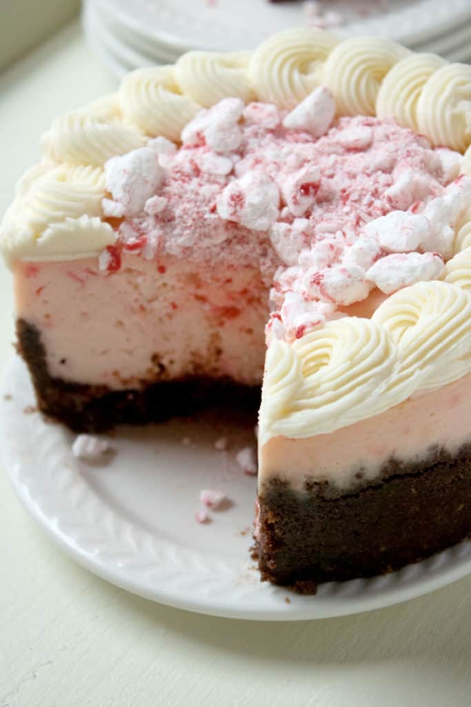 peppermint cheesecake with chocolate crust on white plate