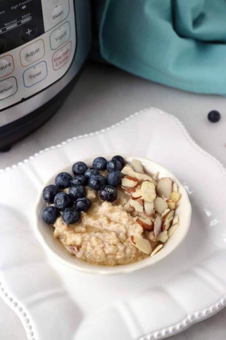 steel cut oatmeal in bowl with blueberries and almonds