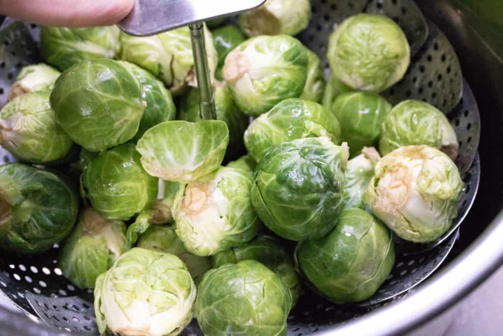 Rinse the Brussels sprouts