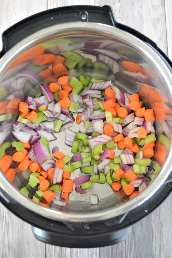 sautéing celery, carrots, and onions in Instant Pot for beef and vegetable soup