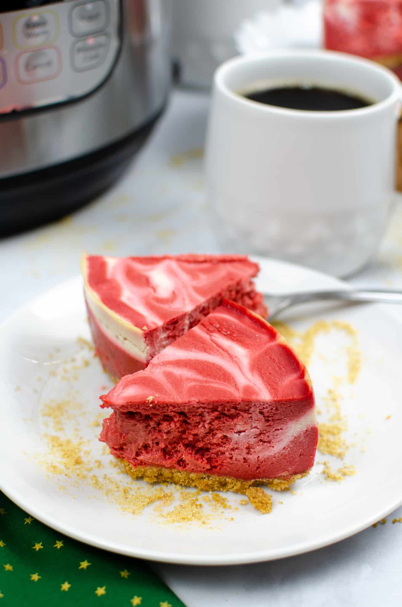 Christmas dessert recipe Instant Pot red swirl cheesecake slices on white plate