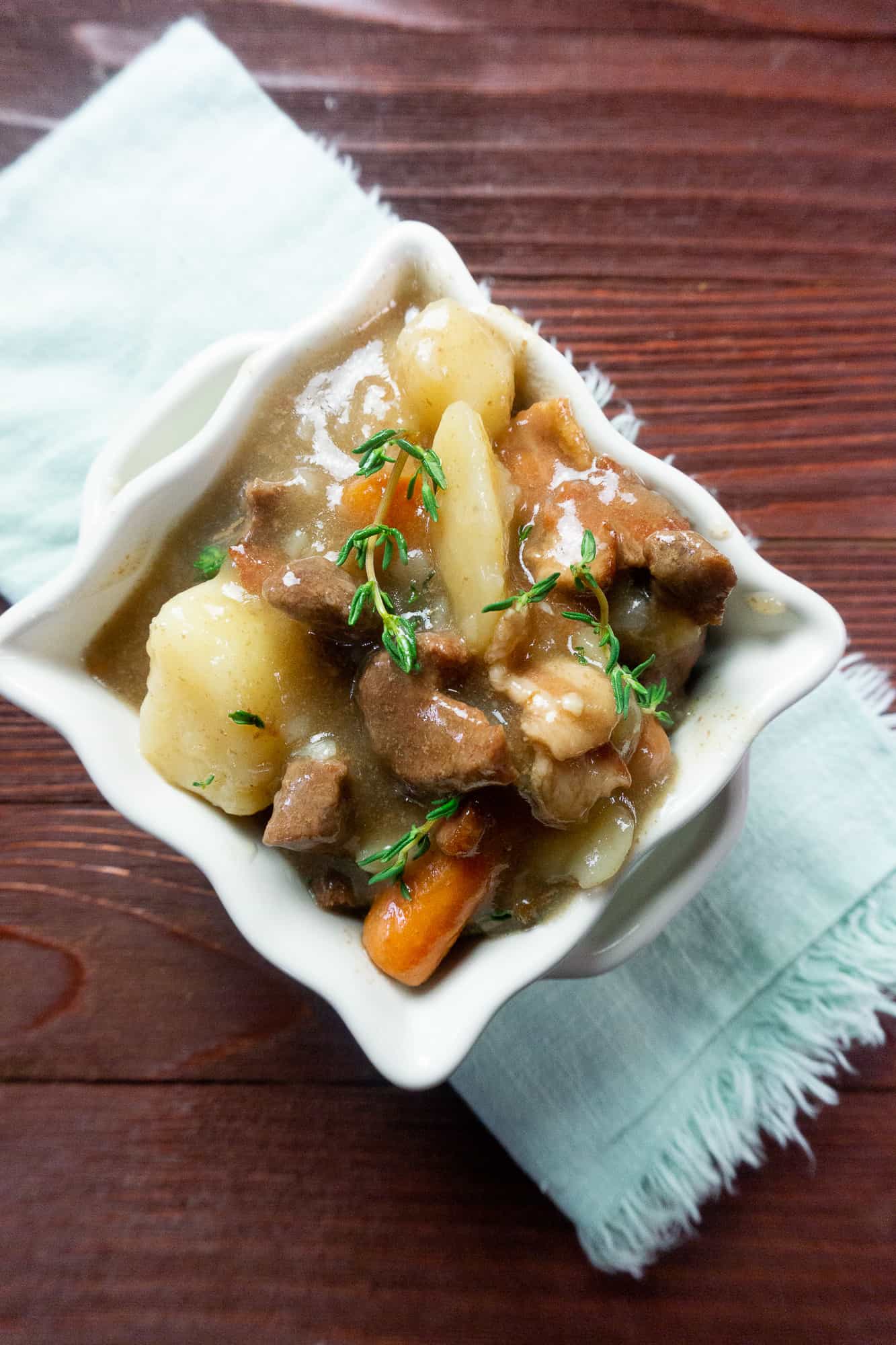 instant pot beef and potato stew in white bowl