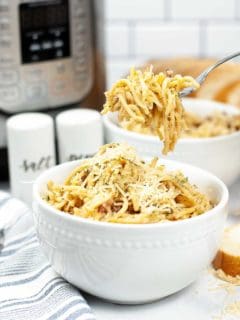 pasta carbonara in white bowl