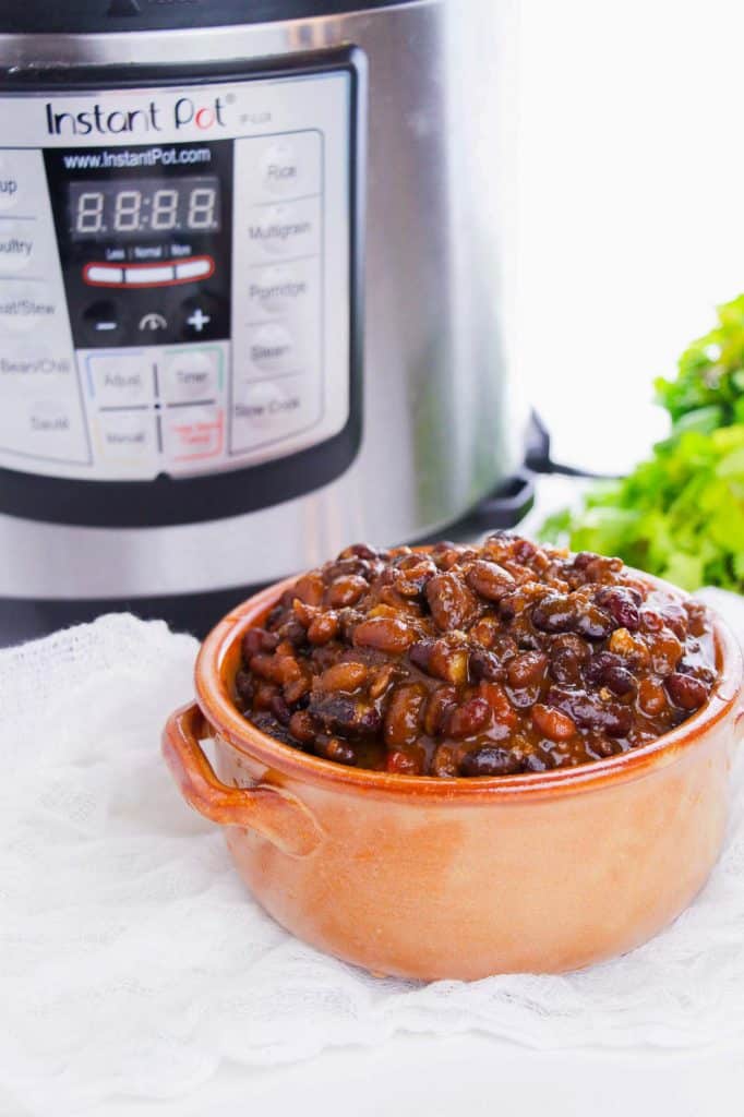 chili in a bowl in front of an Instant Pot
