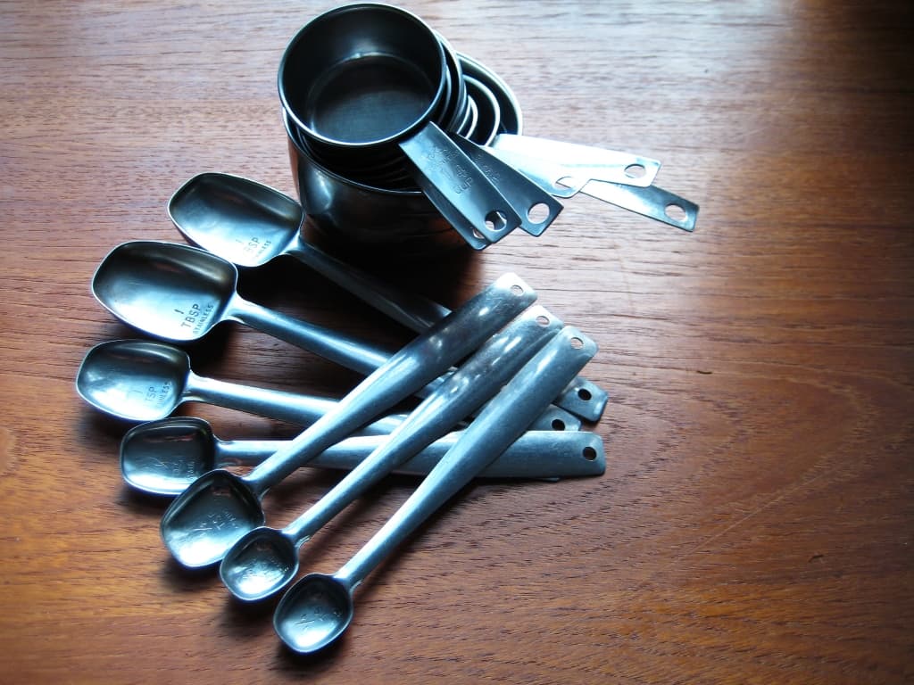 measuring cups and spoons on a table